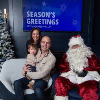 Parents with young son with Santa